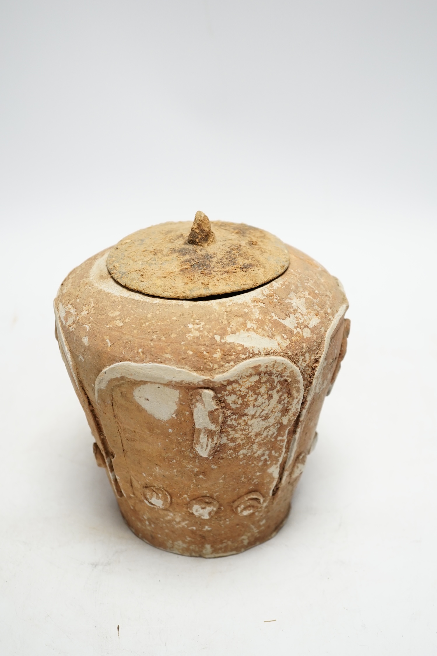 A Chinese pottery figural jar and associated cover, Yuan dynasty, 19cm high